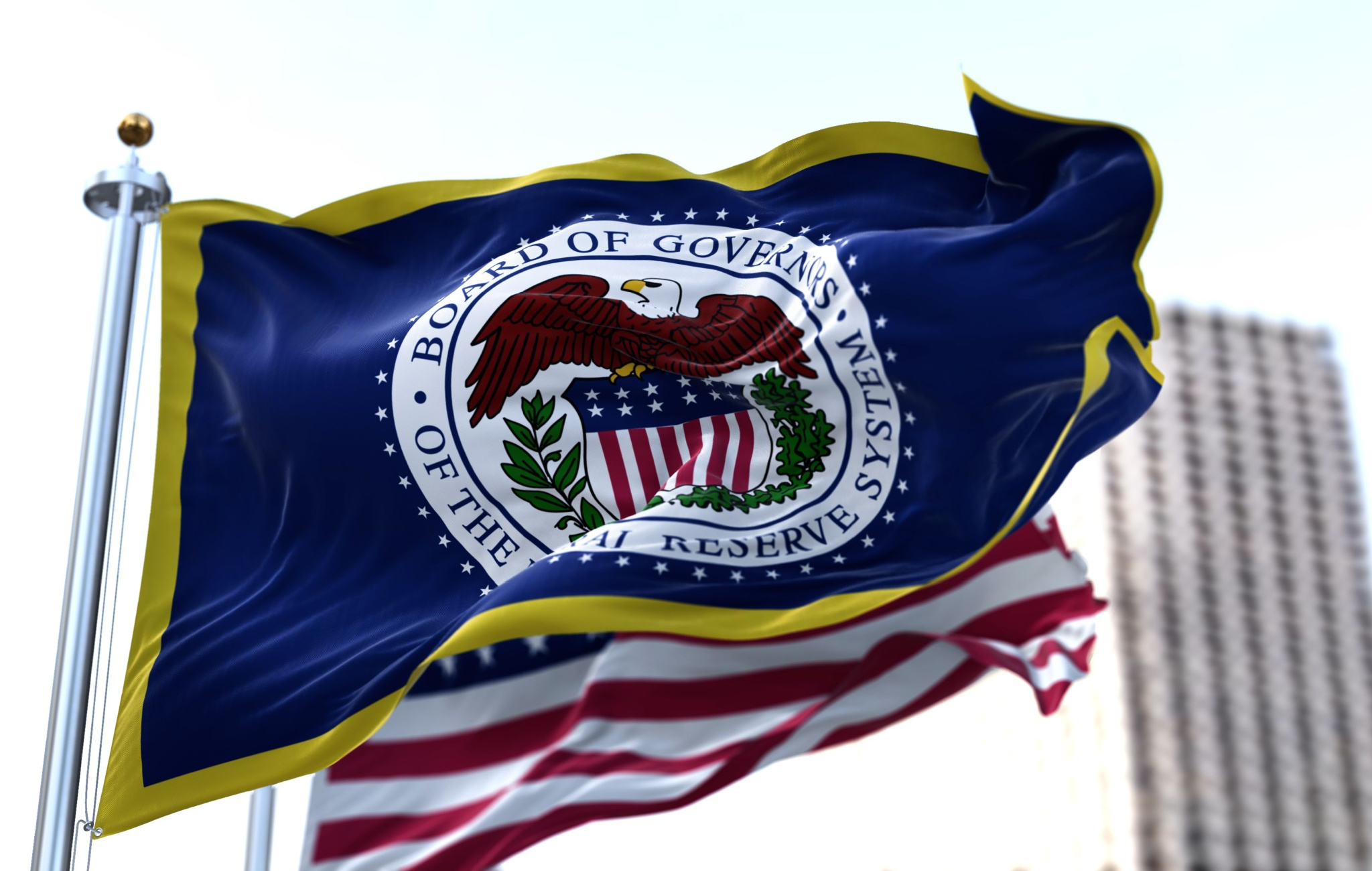 The flag of the American Federal Reserve System waving in the wind with the flag of the United States Washington DC March 2022
